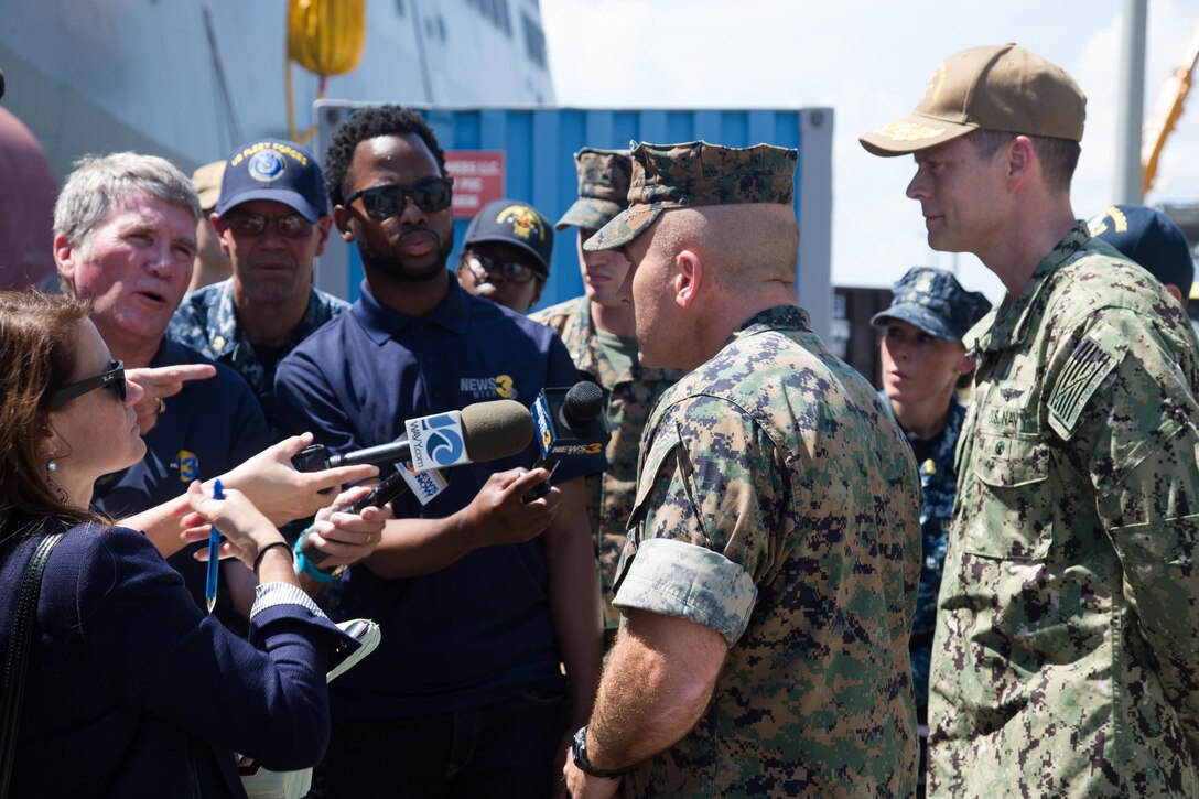 U.S. Marine Corps Col. Farrell J. Sullivan, center, commanding officer, 26th Marine Expeditionary Unit (MEU), addresses local media aboard the USS Kearsarge at Naval Station Norfolk, Va., Aug. 31, 2017. Approximately 690 Marines from the 26th MEU, II Marine Expeditionary Force, embarked aboard the USS Kearsarge (LHD 3) as part of prudent preparatory measures in anticipation of future tasking to support relief efforts in the aftermath of Hurricane Harvey. (U.S. Marine Corps photo by Lance Cpl. Alexis C. Schneider)