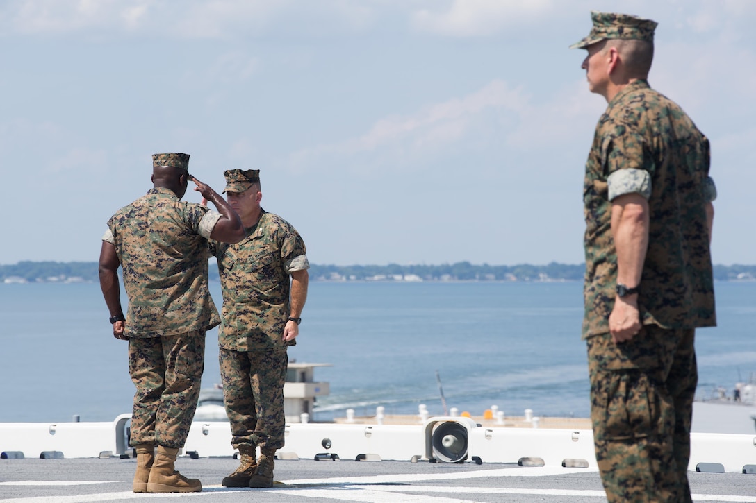 U.S. Marine Corps Col. Farrell J. Sullivan, center, commanding officer, 26th Marine Expeditionary Unit (MEU), takes control of a formation from Sgt. Maj. Jeffery Young, sergeant major, 26th MEU, before going underway aboard the USS Kearsarge at Naval Station Norfolk, Va., Aug. 31, 2017. Approximately 690 Marines from the 26th MEU, II Marine Expeditionary Force, embarked aboard the USS Kearsarge (LHD 3) as part of prudent preparatory measures in anticipation of future tasking to support relief efforts in the aftermath of Hurricane Harvey. (U.S. Marine Corps photo by Lance Cpl. Alexis C. Schneider)