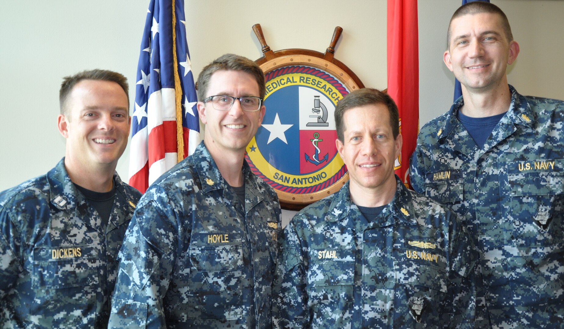 (From left) Lt. (Dr.) Noel Dickens, principal investigator and department head of biomaterials and epidemiology; Lt. Cmdr. (Dr.) Jeffery Hoyle, principal investigator and department head of maxillofacial injury and disease; Capt. (Dr.) Jonathan Stahl, principal investigator in the biomaterials and epidemiology department and  Lt. Cmdr. (Dr.) Nicholas Hamlin, principal investigator and department head of environmental surveillance, continue a strong tradition of dedicating their service to ensure dental readiness and heath for service members around the globe by being at the forefront of dental research, science and innovation.