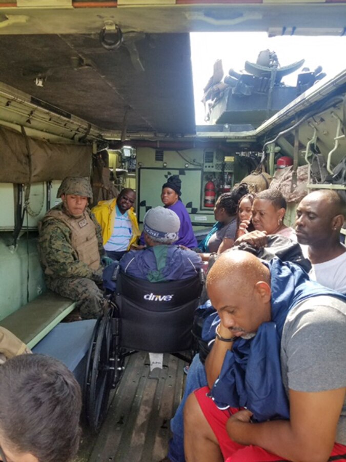 Marines with Company C, 4th Assault Amphibian Battalion, 4th Marine Division, load Hurricane Harvey victims aboard Amphibious Assault Vehicles during rescue operations and immediate response missions in response to Hurricane Harvey at Galveston, Texas, Aug. 31, 2017. The Marines and Sailors with Marine Forces Reserve are posturing ground, air and logistical assets as part of the Department of Defense support to FEMA, state and local response efforts in the aftermath of Hurricane Harvey.