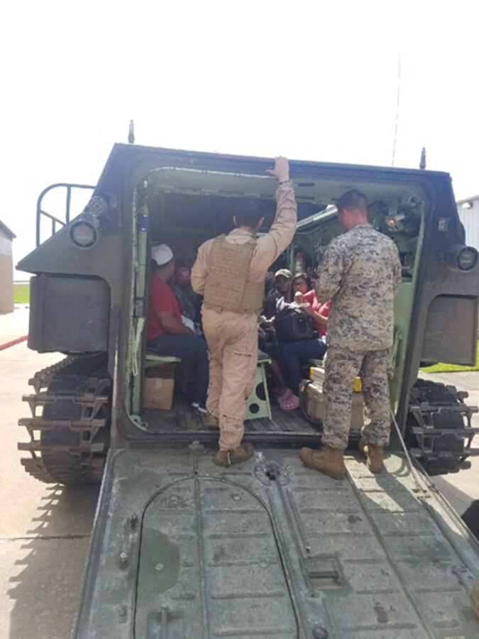 Marines with Company C, 4th Assault Amphibian Battalion, 4th Marine Division, load Hurricane Harvey victims aboard Amphibious Assault Vehicles during rescue operations and immediate response missions in response to Hurricane Harvey at Galveston, Texas, Aug. 31, 2017. The Marines and Sailors with Marine Forces Reserve are posturing ground, air and logistical assets as part of the Department of Defense support to FEMA, state and local response efforts in the aftermath of Hurricane Harvey.