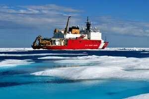 A Coast Guard Cutter sits off the Alaskan coast.