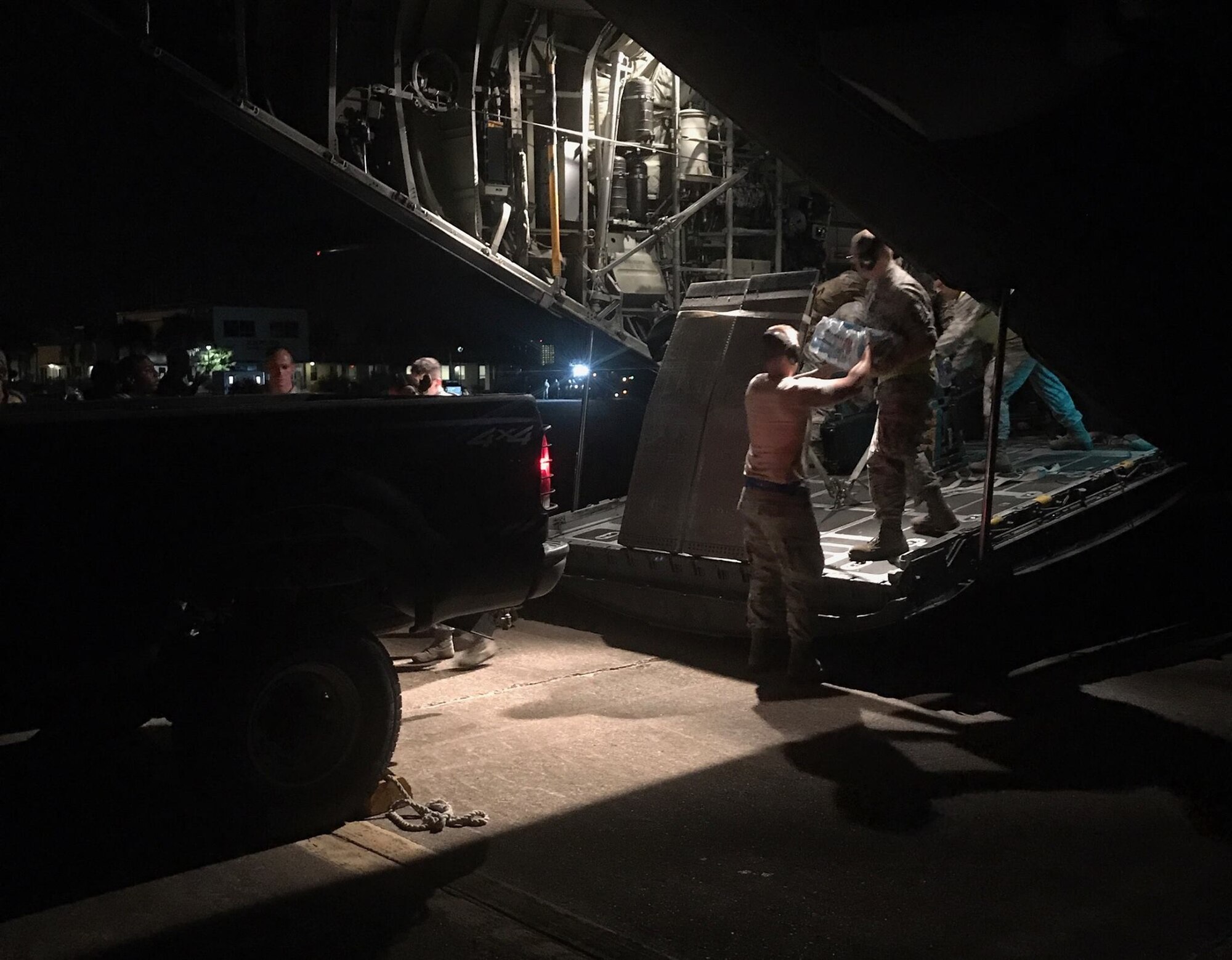 Airmen from the 136th Airlift Wing, Texas Air National Guard, airlift victims of Hurricane Harvey to safety and bring in supplies, personnel, and equipment into hard-hit areas, August 31, 2017.
Airmen from the wing's 136th Airlift Control Flight have been working around the clock airlifting 290 tons of cargo and 468 evacuees since first tasked on August 28. (U.S. Air National Guard courtesy photo)