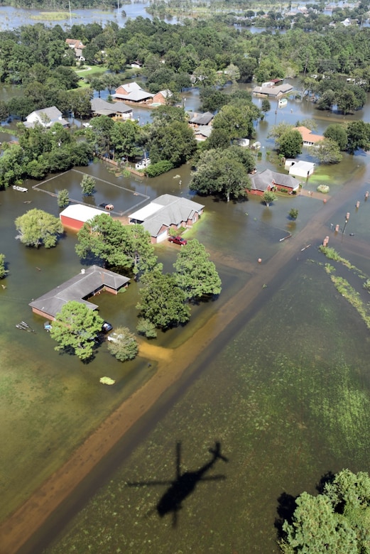 Rescue teams from the 920th Rescue Wing, Patrick Air Force Base, Florida, survey the flooded scene below scanning for stranded victims of Hurricane Harvey Aug. 31, 2017 over Beaumont, Texas. The 920th RQW deployed roughly 90 Citizen Airmen, three Pave Hawks and two HC-130Ns in support of Air Force Northern’s search and rescue mission for FEMA disaster relief efforts. (U.S. Air Force photo/Tech. Sgt. Lindsey Maurice)