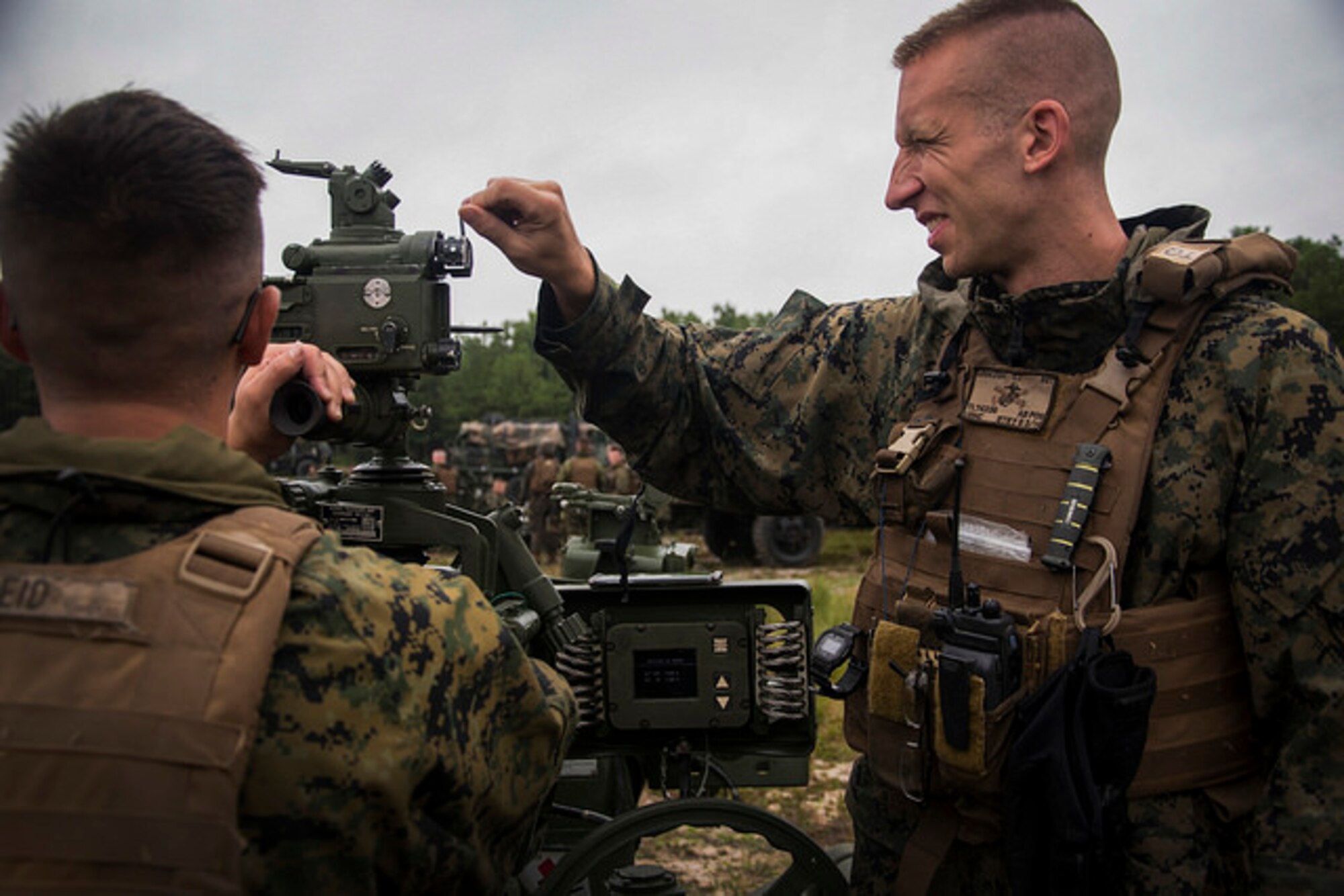 U.S. Marine Corps Sgt. Tyler J. Legezdh, Battery G, 3rd Battalion, 14th Marines howitzer section chief, ensures the M777A2 howitzer is leveled properly during artillery training at Joint Base McGuire-Dix-Lakehurst, N.J. on Aug. 18, 2017.  The M777A2 howitzer provides timely, accurate and continuous firepower in support of Marine and Army infantry force. (U.S. Air Force photo by Airman 1st Class Jessica Blair)