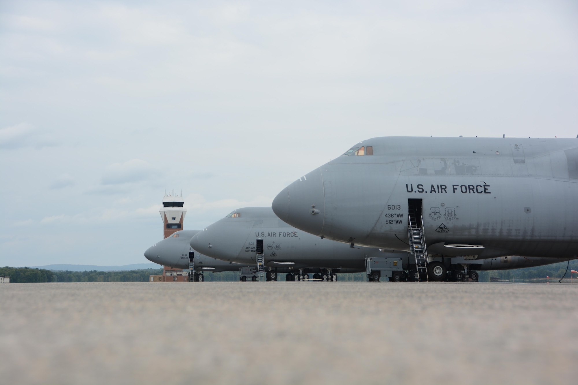 Three C-5M Super Galaxies sit on the flightline August 31, 2017, at Westover Air Reserve Base. C-5s are the largest airlifter in the U.S. Air Force fleet and are capable of transporting large cargo. (U.S. Air Force photo by Airman Hanna N. Smith)