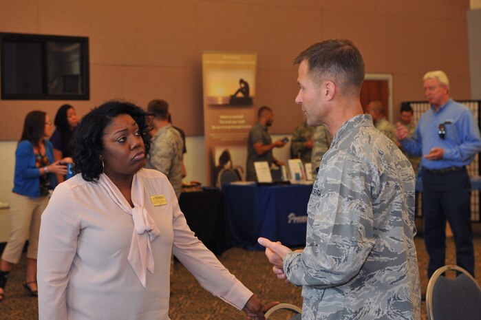 Col. Larry Broadwell, 9th Reconnaissance Wing commander, talks with a member of Team Beale following a town hall