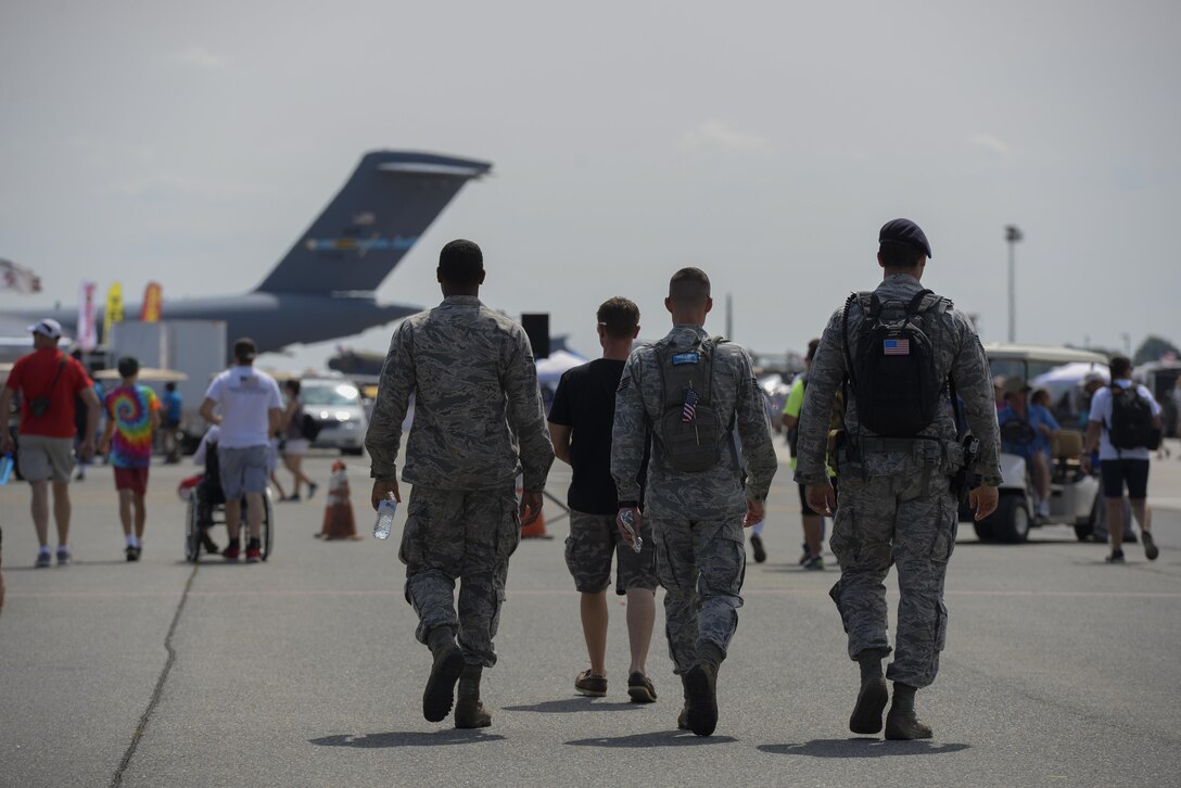 Airmen assigned to Dover Air Force Base complete a security patrol Aug. 27, 2017, during the Thunder Over Dover Open House at Dover AFB, Del. The open house is a way for Dover AFB to thank local and regional communities for their ongoing support. (U.S. Air Force photo by Staff Sgt. Aaron J. Jenne)