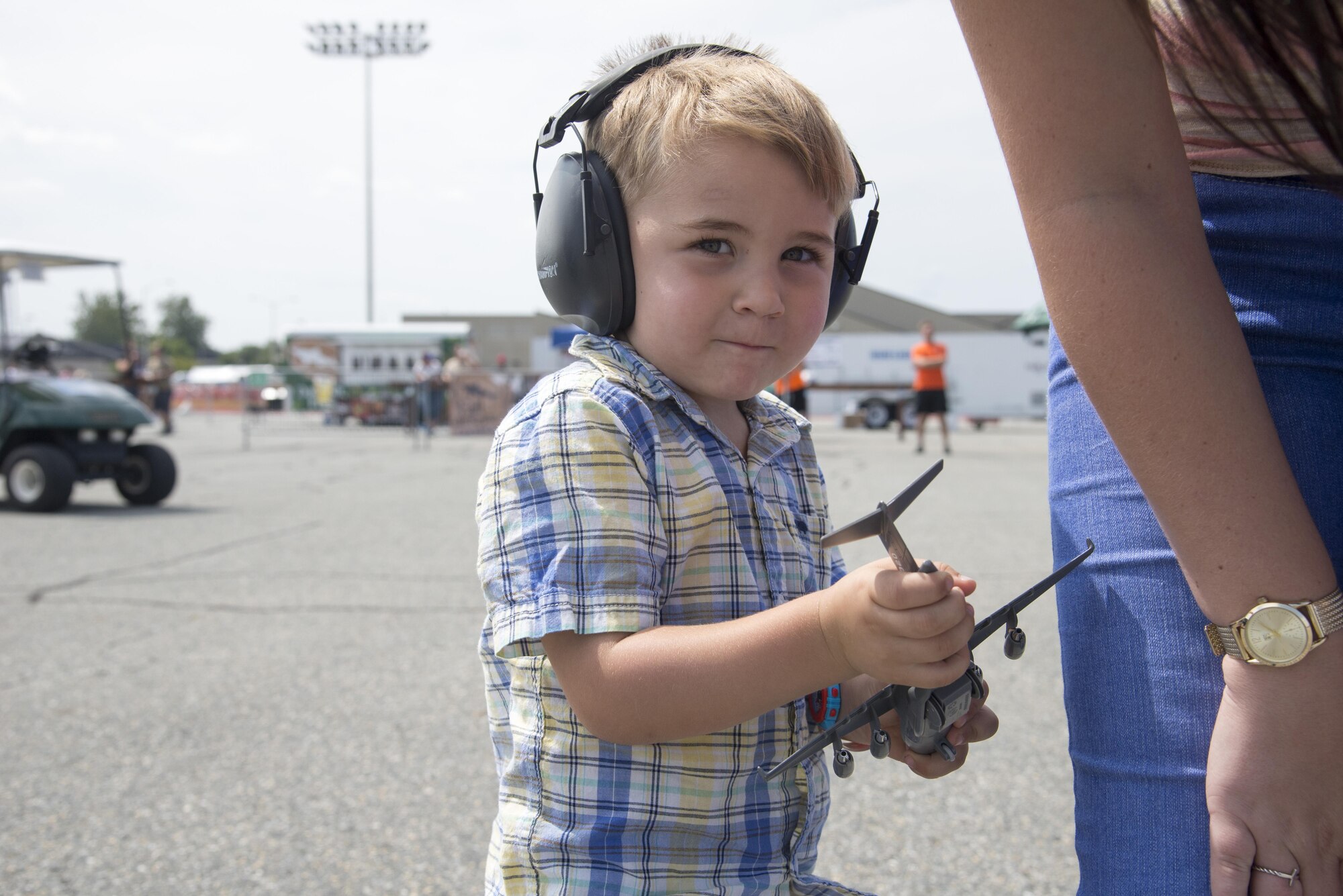 A Team Dover guest holds a C-17 Globemaster III toy during the 2017 Thunder Over Dover Open House Aug. 27, 2017, on Dover Air Force Base, Del. The open house is a way for Dover AFB to thank local and regional communities for their ongoing support. (U.S. Air Force photo by Staff Sgt. Jared Duhon)