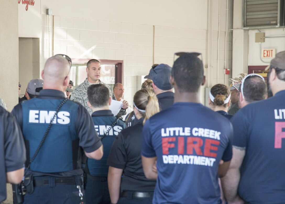 Tech. Sgt. William Jenkins, 436th Civil Engineer Squadron fire station captain, speaks with military and local firefighters before the start of the 2017 Thunder Over Dover Open House Aug. 27, 2017, on Dover Air Force Base, Del. Fire houses from the local area helped to ensure the open house was safe as well as fun. (U.S. Air Force photo by Staff Sgt. Jared Duhon)