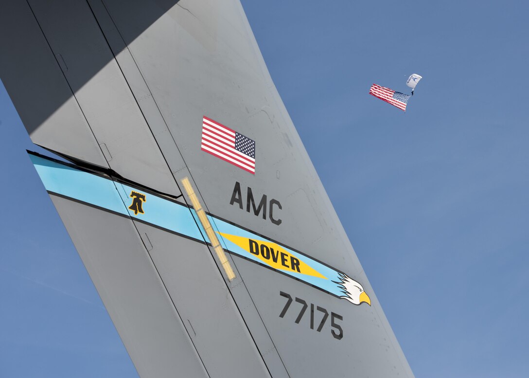 A Black Dagger jumps with an American Flag during the singing of the national anthem during the Thunder Over Dover Open House Aug. 27, 2017, at Dover Air Force Base, Del. The Black Daggers are the U.S. Army Special Operations Command’s Parachute Demonstration Team. (U.S. Air Force photo by Senior Airman Zachary Cacicia)