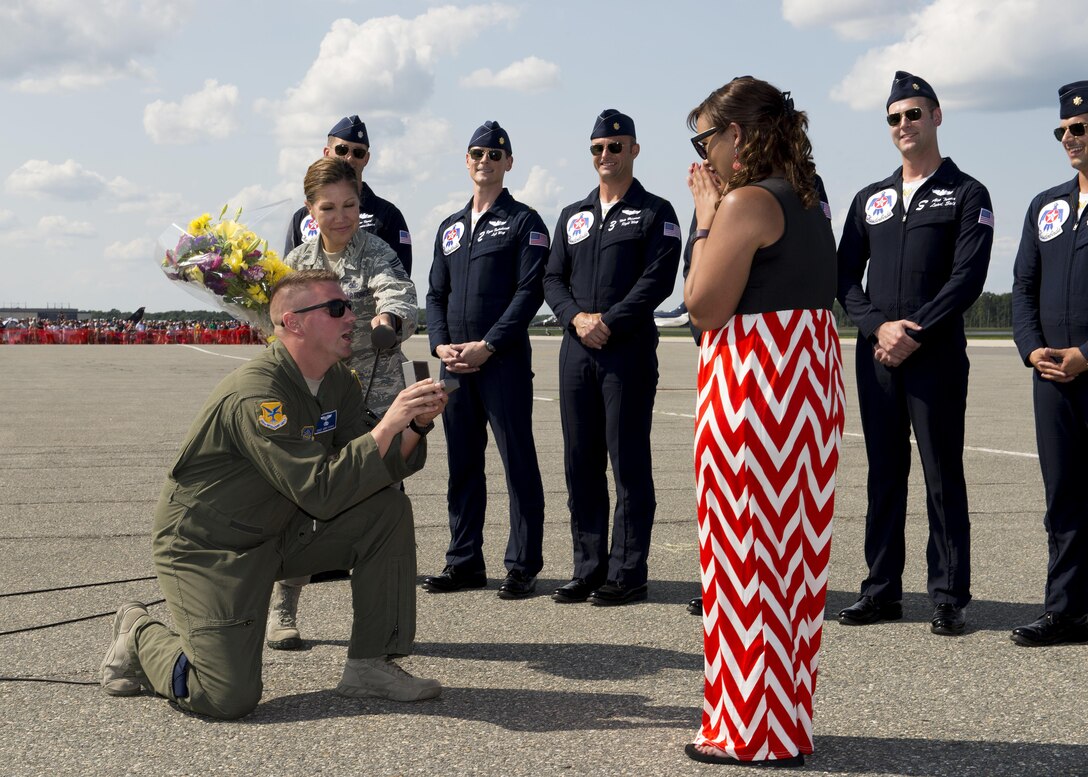 Staff Sgt. Andy Dynan, 436th Operations Group executive, proposes to his girlfriend Katrina Durden during the Thunder Over Dover Open House Aug. 27, 2017, at Dover Air Force Base, Del. Dynan normally works as a loadmaster with the 9th Airlift Squadron. (U.S. Air Force photo by Senior Airman Zachary Cacicia)
