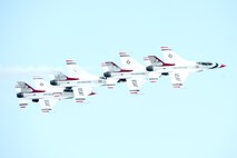 The United States Air Force Thunderbirds perform aerial maneuvers during the Thunder Over Dover Open House and Airshow Aug. 25, 2017, at Dover Air Force Base, Del. The Thunderbirds demonstrated the versatility of the F-16 Fighting Falcon by performing aerial acrobatics, precision formations and high-speed passes during their performance. (U.S. Air Force photo by Mauricio Campino)