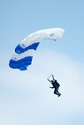 A member of the Wings of Blue parachute team sky dives during the opening ceremony of the Thunder Over Dover Open House and Airshow Aug. 25, 2017, at Dover Air Force Base, Del. This was the first open house held at Dover AFB in eight years. (U.S. Air Force photo by Mauricio Campino)