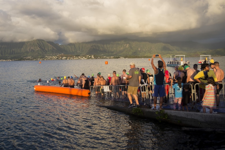 Race participants wait to begin the Tradewind Triathlon aboard Marine Corps Air Station (MCAS) Kaneohe Bay, Aug. 27, 2017. The Tradewind Triathlon involves a 500 meter swim in Kaneohe Bay, a 13 mile bike ride on the MCAS Kaneohe Bay flight line, and a 3 mile run around the base. The event is part of the Commanding Officer Race Series and is open for the public to participate in. (U.S. Marine Corps photo by Lance Cpl. Isabelo Tabanguil)