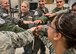 Members of the 375th Aeromedical Evacuation Squadron come together before the team mobilizes in support Hurricane Harvey relief and response efforts, Scott Air Force Base, Ill., Aug. 30, 2017.  The 375th Logistics Readiness Squadron loaded 6.5 tons of medical supplies onto a C-17 Globemaster III for the nine-person medical team. The 375th AES crew, prepared to provide relief for 30 days, will be staged at Little Rock Air Force Base, where they will pick up high-priority patients from George Bush Intercontinental Airport and transport them to one of seven hospital locations across the states of Texas, Oklahoma, Louisiana, Tennessee, Mississippi, and Alabama.   (U.S. Air Force photo by Tech. Sgt. Jodi Martinez)