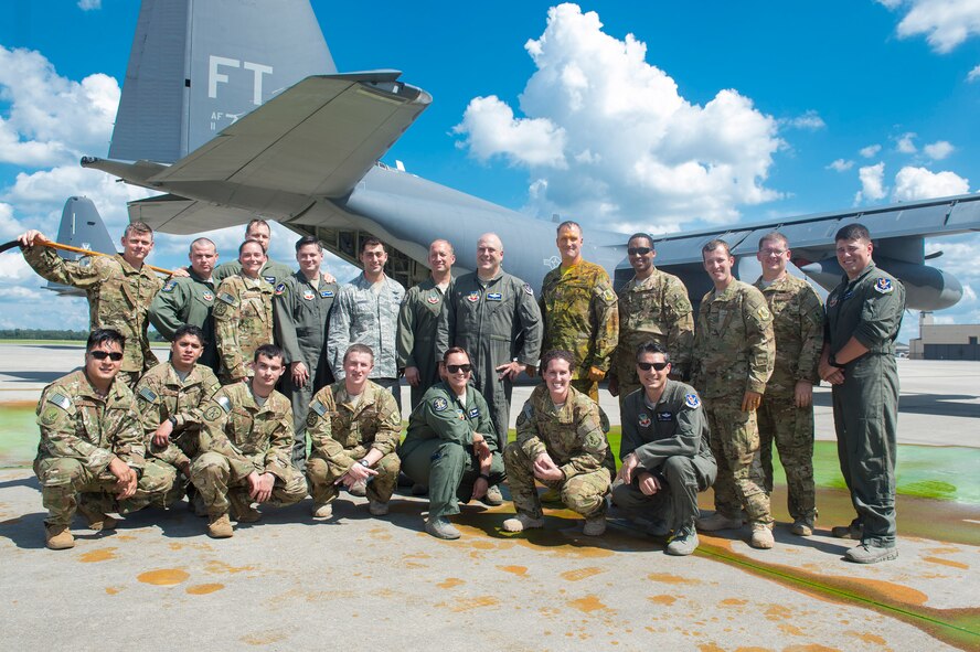 Chief Master Sgt. Brandon Broughman, 347th Rescue Group superintendent, poses with fellow 347th RQG loadmasters after his final flight, Aug. 17, 2017, at Moody Air Force Base, Ga. Broughman concluded his 30-year career as a loadmaster on Sept. 1. During his tenure, he dedicated service to more than 5 variants of C-130’s in air mobility and tactical airlift support. (U.S. Air Force photo by Senior Airman Greg Nash)