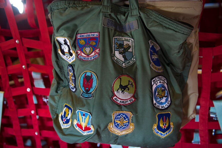 A bag donning patches of the different units Chief Master Sgt. Brandon Broughman, 347th Rescue Group superintendent, has been assigned to displays an HC-130J Combat King II during a final flight Aug. 17, 2017, at Moody Air Force Base, Ga. Broughman concluded his 30-year career as a loadmaster on Sept. 1. During his tenure, he dedicated service to more than 5 variants of C-130’s in air mobility and tactical airlift support. (U.S. Air Force photo by Tech. Sgt. Timothy Gallagher)