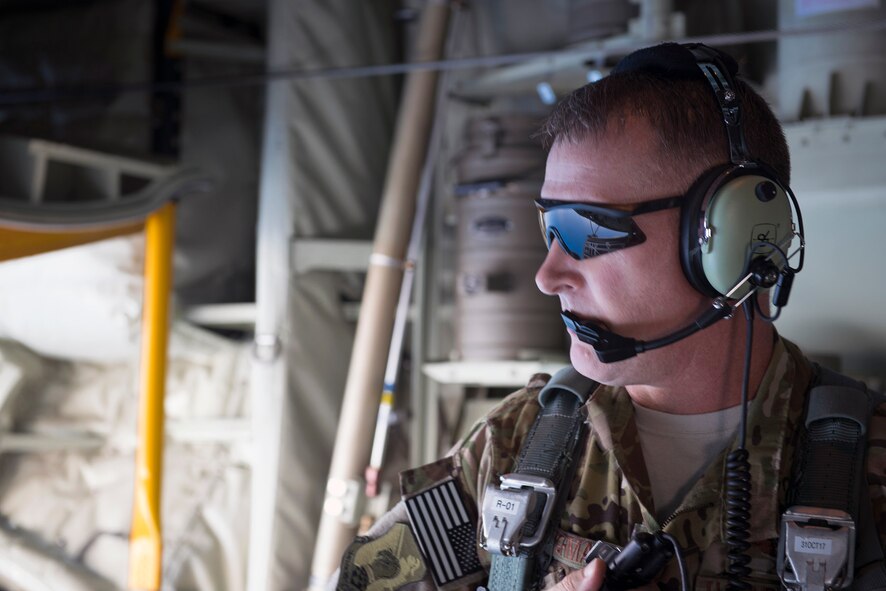 Chief Master Sgt. Brandon Broughman, 347th Rescue Group superintendent, views the back of an HC-130J Combat King II, during his final flight, Aug. 17, 2017, in coastal Florida. Broughman concluded his 30-year career as a loadmaster. During his tenure, he dedicated service to more than 5 variants of C-130’s in air mobility and tactical air drop support. (U.S. Air Force photo by Tech. Sgt. Timothy Gallagher)