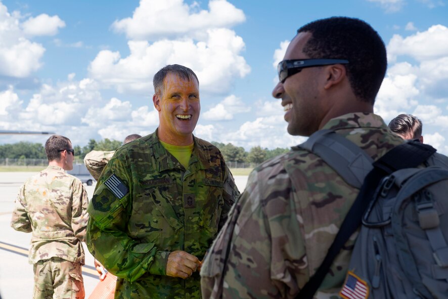 Chief Master Sgt. Brandon Broughman, 347th Rescue Group superintendent, shares a laugh with Tech. Sgt. Curtis Copeland, 71st Rescue Squadron loadmaster, after Broughman’s final flight, Aug. 17, 2017, at Moody Air Force Base, Ga. Broughman concluded his 30-year career as a loadmaster. During his tenure, he dedicated service to more than 5 variants of C-130’s in air mobility and tactical airdrop support. (U.S. Air Force photo by Senior Airman Greg Nash)