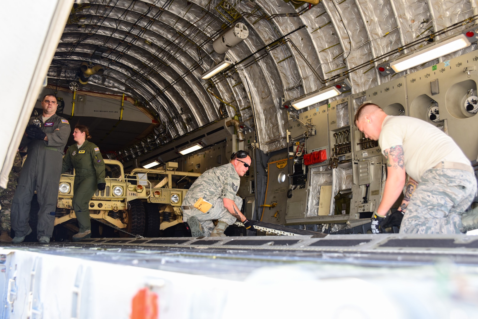 Texas Air National Guard airmen load a Lockheed C-130 Hercules on the flightline