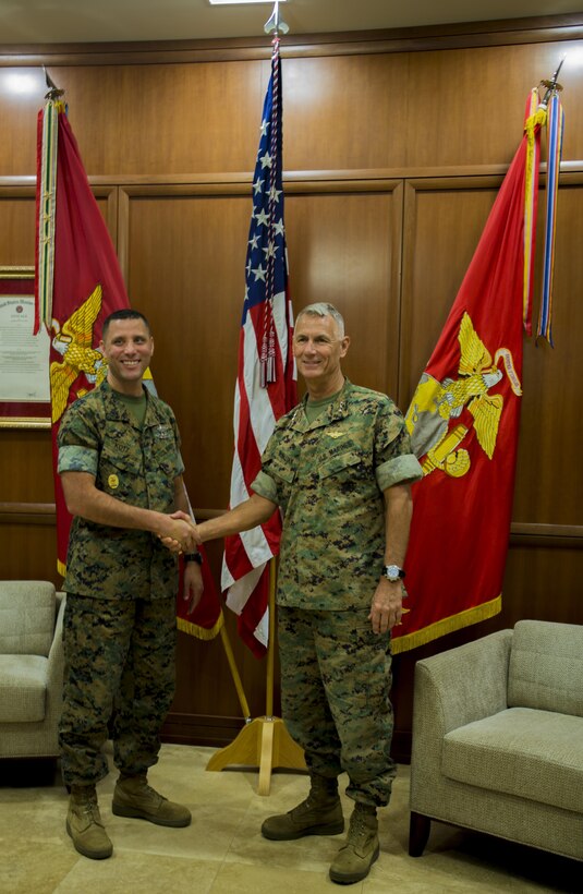 Master Chief Christopher D. Kotz (left), command master chief Marine Forces Reserve and Marine Forces North, poses for a photo with Lt. Gen. Rex C. McMillian (right), commander of MARFORRES and MARFORNORTH, during the command master chief change of office at Marine Corps Support Facility New Orleans on Sep. 1, 2017.
