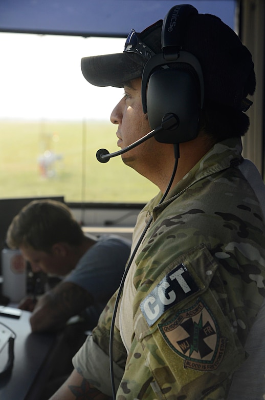 Air Force Tech. Sgt. Daniel Resendez, 350th Battlefield Airman Training Squadron combat controller, communicates with helicopters.