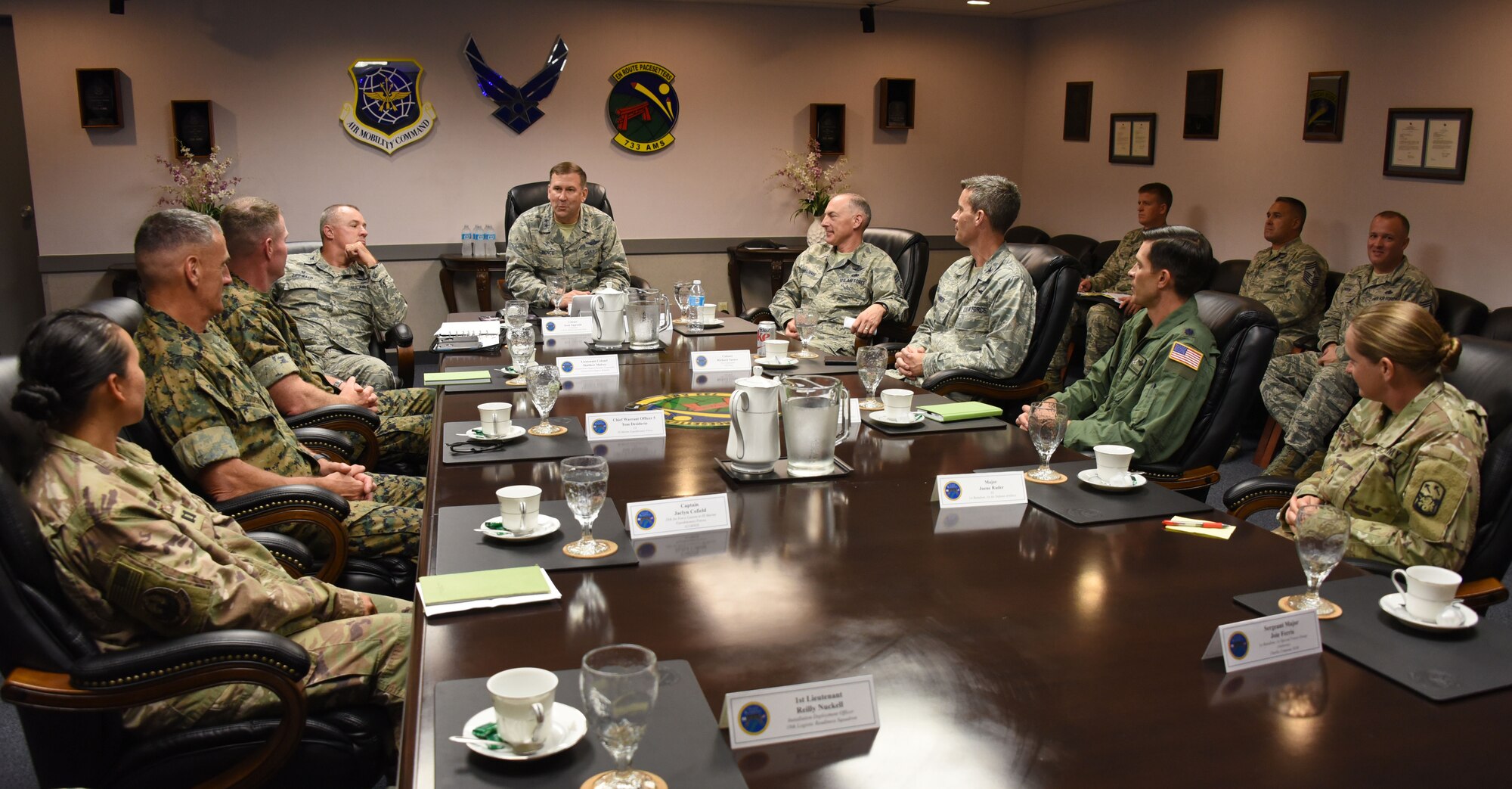 Maj. Gen. Christopher Bence, (center) commander, USAF Expeditionary Center, and Command Chief Master Sgt. Larry Williams (center-right), USAF Expeditionary Center command chief, attend a joint partners mission brief at Kadena Air Base, Japan on Aug. 23. Kadena was one stop the EC leadership team made during an immersion tour of three air mobility squadrons of the 515th Air Mobility Operations Wing in Japan and South Korea. (U.S. Air Force photo by Tech. Sgt. Jamie Powell)