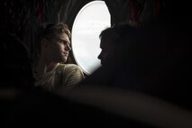 A pararescueman from the 48th Rescue Squadron looks through the window of a CH-47 Chinook an the floodwaters in Eastern Texas, Aug. 30, 2017. The 347th and 563d Rescue Groups from Moody Air Force Base, Ga., Nellis AFB, Nev., and Davis Montana AFB, Ariz., sent rescue boat teams to Orange County, Texas, and the surrounding areas in support of FEMA during Hurricane Harvey disaster response efforts. (U.S. Air Force photo by Staff Sgt. Ryan Callaghan)