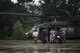Airmen and Soldiers assist victims out of a UH-60 Black Hawk, Aug. 30, 2017, at the Orange County Convention and Expo Center in Orange, Texas. The 347th and 563d Rescue Groups from Moody Air Force Base, Ga., Nellis AFB, Nev., and Davis Montana AFB, Ariz., sent rescue boat teams to Orange County, Texas, and the surrounding areas in support of FEMA during Hurricane Harvey disaster response efforts. (U.S. Air Force photo by Staff Sgt. Ryan Callaghan)
