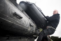 A pararescueman from the 58th Rescue Squadron pushes a stack of rescue boats onto a transport vehicle prior to a rescue mission, Aug. 30, 2017, at the Orange County Convention and Expo Center in Orange, Texas. The 347th and 563d Rescue Groups from Moody Air Force Base, Ga., Nellis AFB, Nev., and Davis Montana AFB, Ariz., sent rescue boat teams to Orange County, Texas, and the surrounding areas in support of FEMA during Hurricane Harvey disaster response efforts. (U.S. Air Force photo by Staff Sgt. Ryan Callaghan)