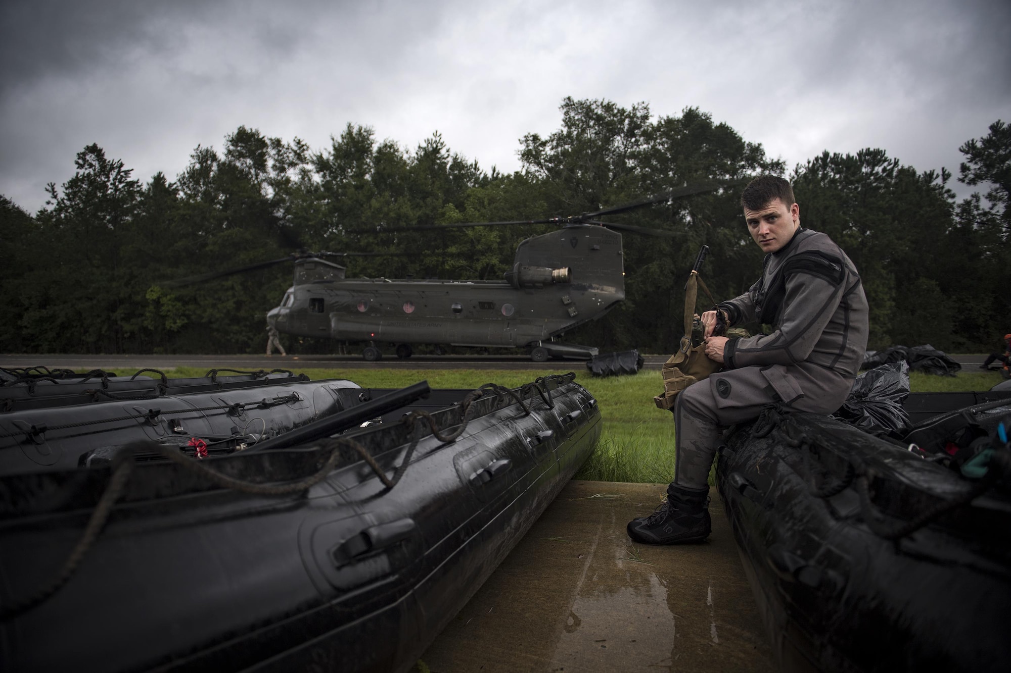 A pararescueman from the 58th Rescue Squadron prepares his gear for a rescue mission, Aug. 30, 2017, at the Orange County Convention and Expo Center in Orange, Texas.