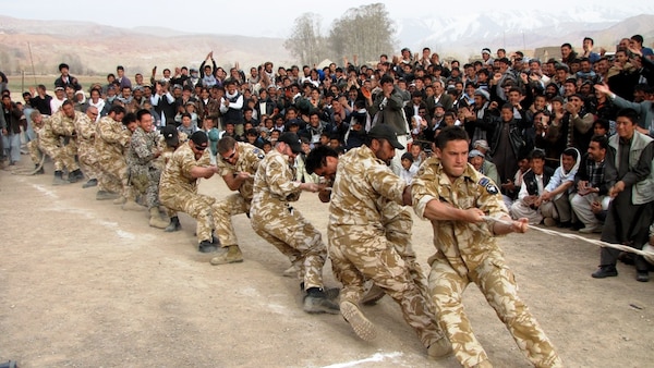 In 2010, the New Zealand Provincial Reconstruction Team participates in a tug-a-war challenge between teams from the various villages around Bamyan Province in Afghanistan.