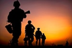 In 2010, U.S. marines depart a checkpoint during a patrol around Forward Operating Base Geronimo, Afghanistan.