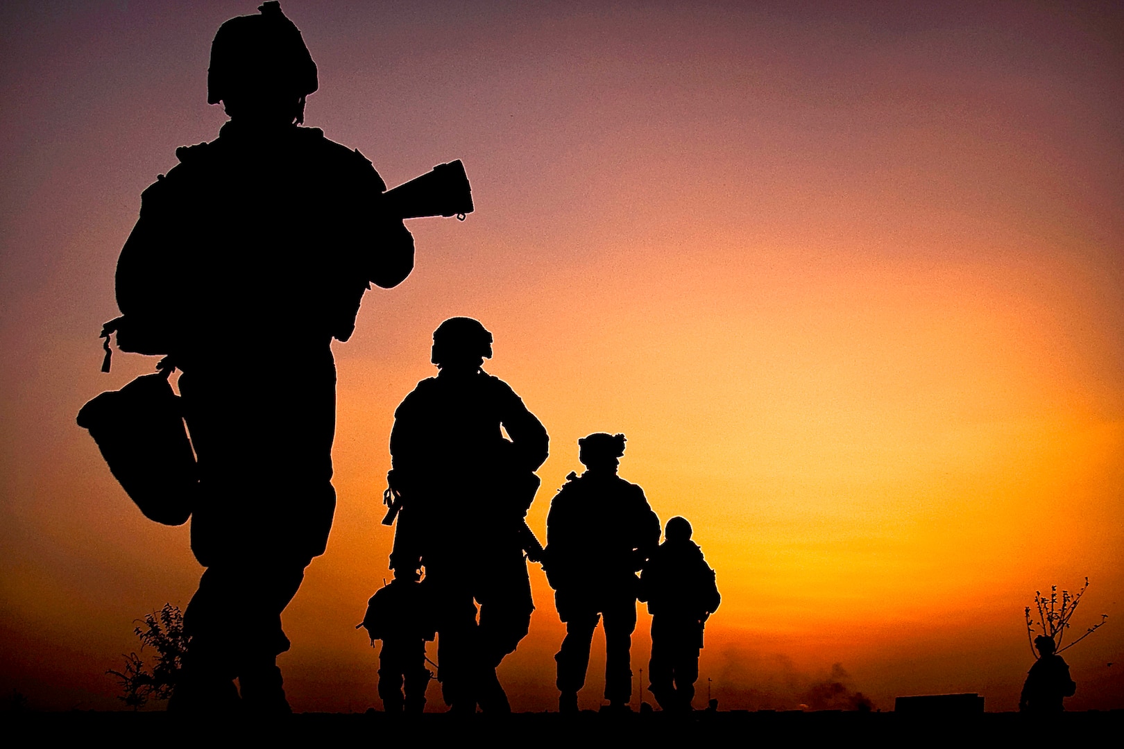 In 2010, U.S. marines depart a checkpoint during a patrol around Forward Operating Base Geronimo, Afghanistan.