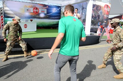 Two Soldiers play a game of soccer in the fan zone Sept. 1 prior to the U.S. Men’s Soccer game at Red Bull Arena in Harrison, New Jersey.  Service members from the Army and Air Force held the U.S. flag for the national anthem prior to the start of the game.