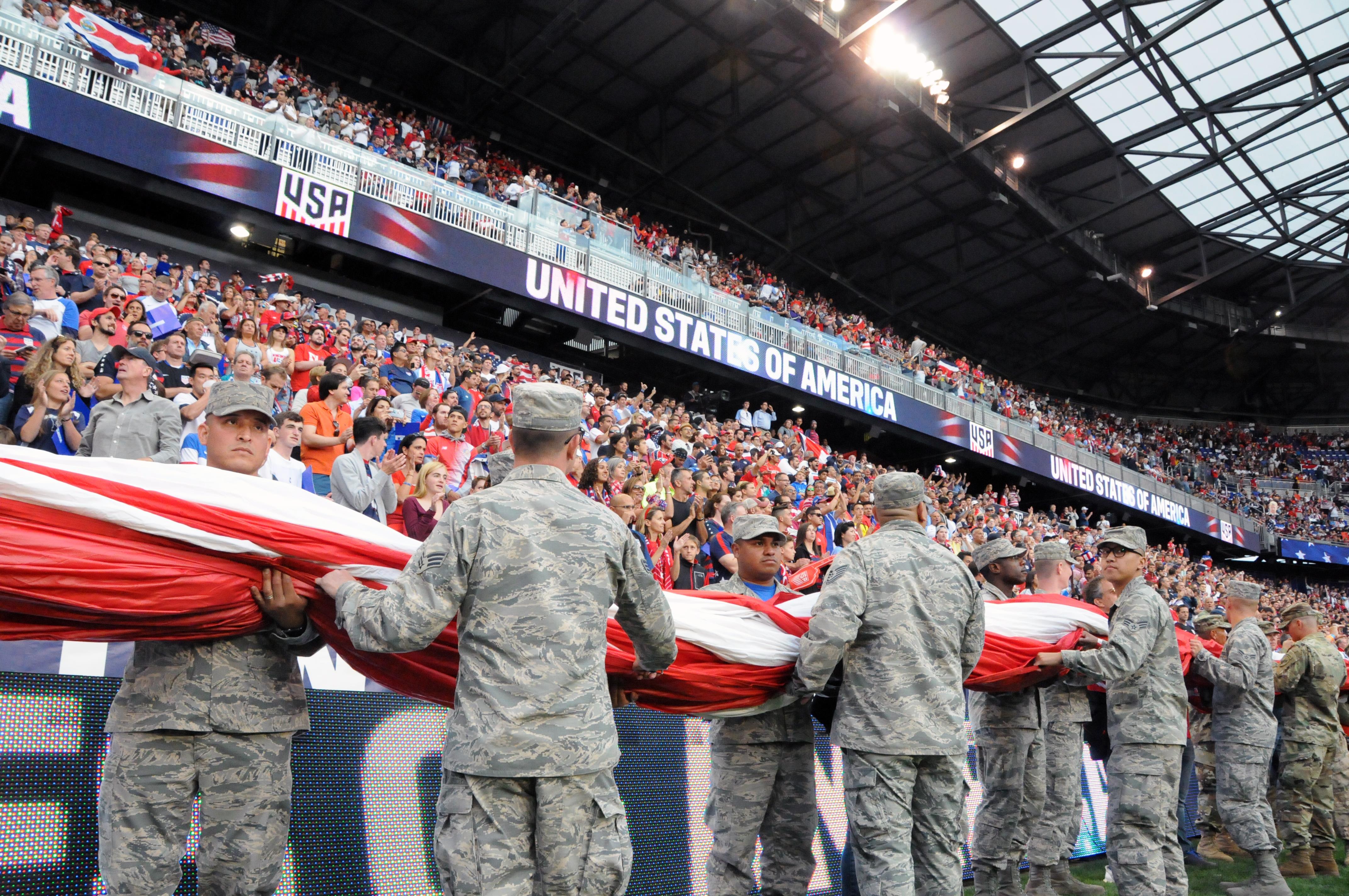 Service members hit the field with the United States men's national soccer team