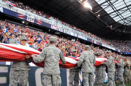 Service members from the Army and Air Force walk into Red Bull Arena Sept. 1 prior to a United States men's national soccer team game.  The service members were there to hold the U.S. flag for the national anthem as part of a military appreciation theme for the game.