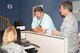 During Hurricane Harvey crisis-action team operations at the 601st Air Operation Center here, Curtis McNeil, Air Forces Northern Deputy Judge Advocate General, talks about legal issues of operational missions with Lt. Col. Robin Rowe, deployed from the 20th Fighter Wing, S.C., legal office, and Lt. Col. Byron Greene, 601st AOC legal office. Both personnel and logistical resources came from across the Air Forces Northern enterprise to assist Northern Command’s support of the Federal Emergency Management Agency’s response to Hurricane Harvey. (Photo by Mary McHale)