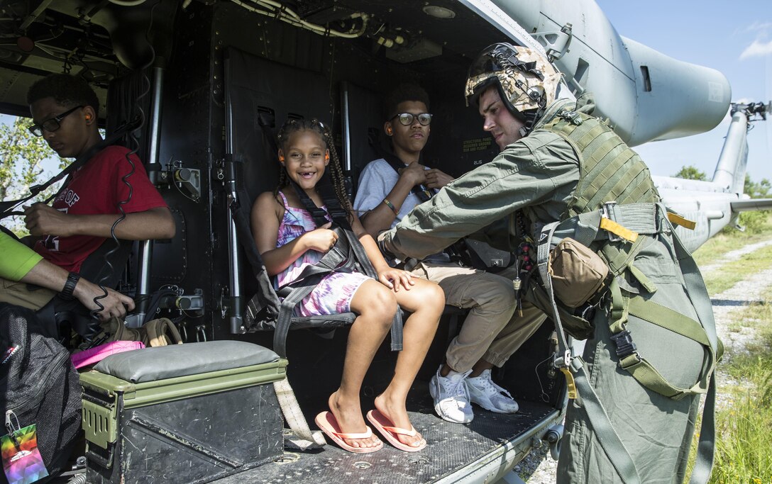 Marines with Detachment A, Marine Light Attack Helicopter Squadron 773, 4th Marine Aircraft Wing, Marine Forces Reserve, ensures a family is safely escorted to a safe location during a rescue mission in wake of Hurricane Harvey in Port Arthur, Texas, August 31, 2017. The Marine Corps Reserve is America’s expeditionary total force in readiness that is always the first to fight, whether on the battlefield or national emergencies.
