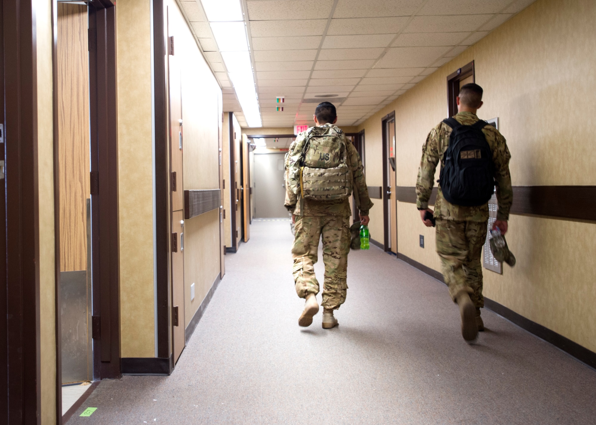 Soldiers walk to their assigned rooms on Sept. 2, at the old Wilford Hall Ambulatory Surgical Center on Joint Base San Antonio-Lackland, Texas. More than 500 soldiers are awaiting future deployment instructions at the old Wilford Hall in response to the devastation caused by Hurricane Harvey. (U.S. Air Force photo/Staff Sgt. Kevin Iinuma)