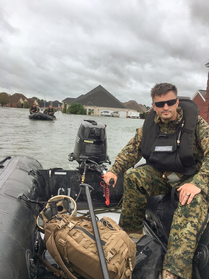 Marines with 4th Reconnaissance Battalion, 4th Marine Division, Marine Forces Reserve, wade through thigh deep water in search of people in need of aid in Port Arthur, Texas, Aug. 31, 2017. Over the course of several days, Marine Forces Reserve units transported over 1,200 people from heavily flooded areas in southeast Texas in coordination with local law enforcement and joint agencies following the effects of Hurricane Harvey. (Courtesy photo by Pfc. Levi Bayard/Released)