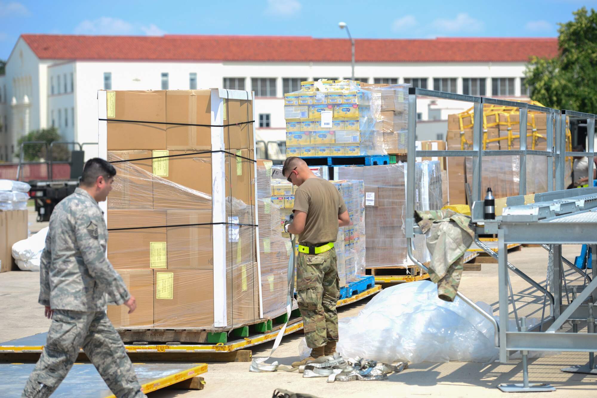 Members with 502nd Logistics Readiness Squadron and U.S. Army Soldiers unload a Royal Canadian Air Force CC-130J Hercules at Joint Base San Antonio-Lackland Kelly Field, Texas carrying humanitarian supplies from the government of Canada to aid in Hurricane Harvey relief efforts Sept. 3, 2017. The supplies included pediatric necessities like baby formula, blankets, cribs and other similar items. The RCAF airlift flew in from 8 Wing Trenton, Ontario, Canada.