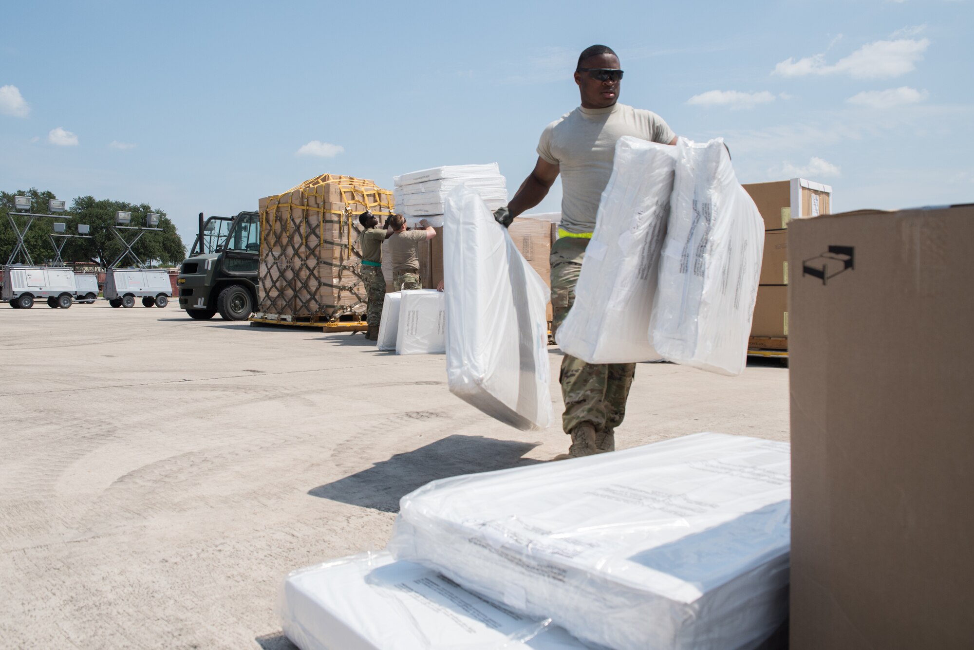 Members with 502nd Logistics Readiness Squadron and U.S. Army Soldiers unload a Royal Canadian Air Force CC-130J Hercules at Joint Base San Antonio-Lackland Kelly Field, Texas carrying humanitarian supplies from the government of Canada to aid in Hurricane Harvey relief efforts Sept. 3, 2017. The supplies included pediatric necessities like baby formula, blankets, cribs and other similar items. The RCAF airlift flew in from 8 Wing Trenton, Ontario, Canada.