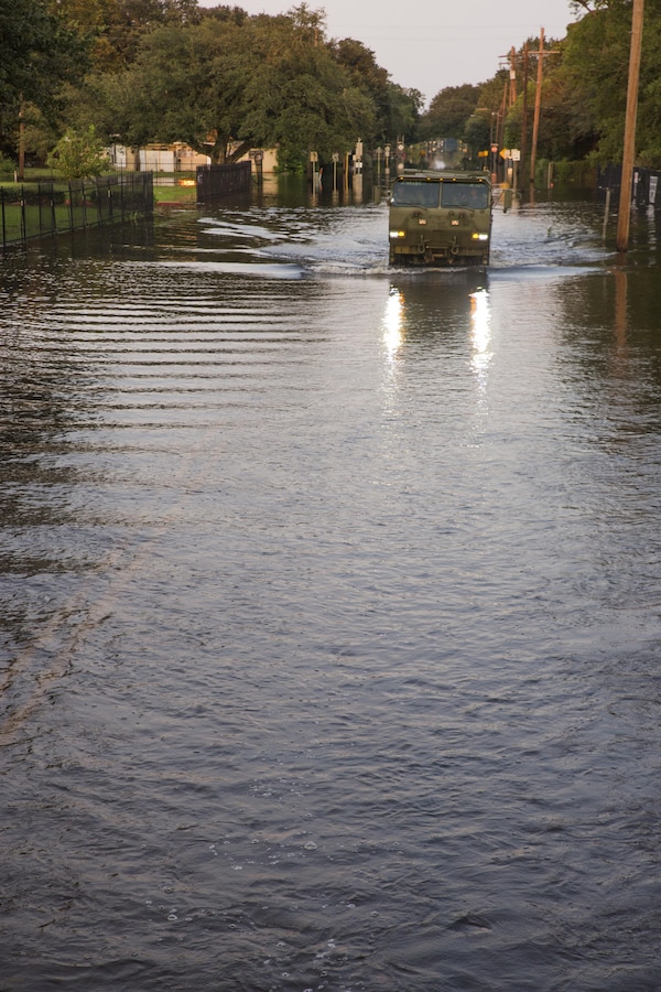 ORANGE, Texas – Marines from 14th Marine Regiment, 4th Marine Division, Marine Forces Reserves, unload supplies from a 7-ton truck to assist families in Orange, Texas, Sept. 3, 2017. The Marines assisted the Red Cross by transporting supplies from the Red Cross warehouse to families in Orange, Texas, affected by Hurricane Harvey. (U.S. Marine Corps photo by Lance Cpl. Niles Lee/Released)