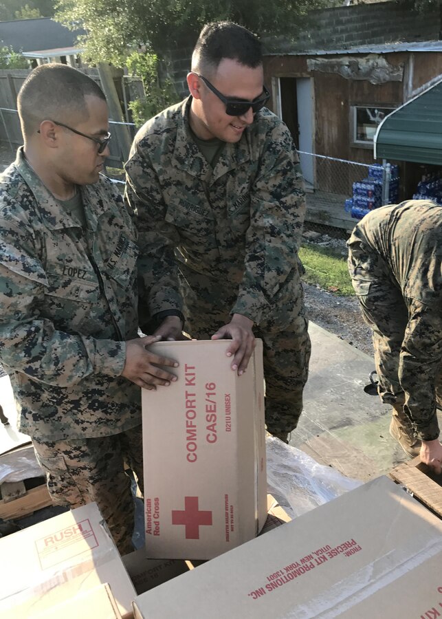 BEAUMONT, TX - U.S. Marines from 14th Marine Regiment, 4th Marine Division, Marine Forces Reserve, unload pallets of water from an MTVR 7-ton truck at Rosehill Acres, Texas, Sept. 3, 2017.  14th Marines, based out of Ft. Worth, Texas, is participating in relief efforts for those effected by Hurricane Harvey. (U.S. Marine Corps photo by Master Sgt. Ricardo Morales/Released)