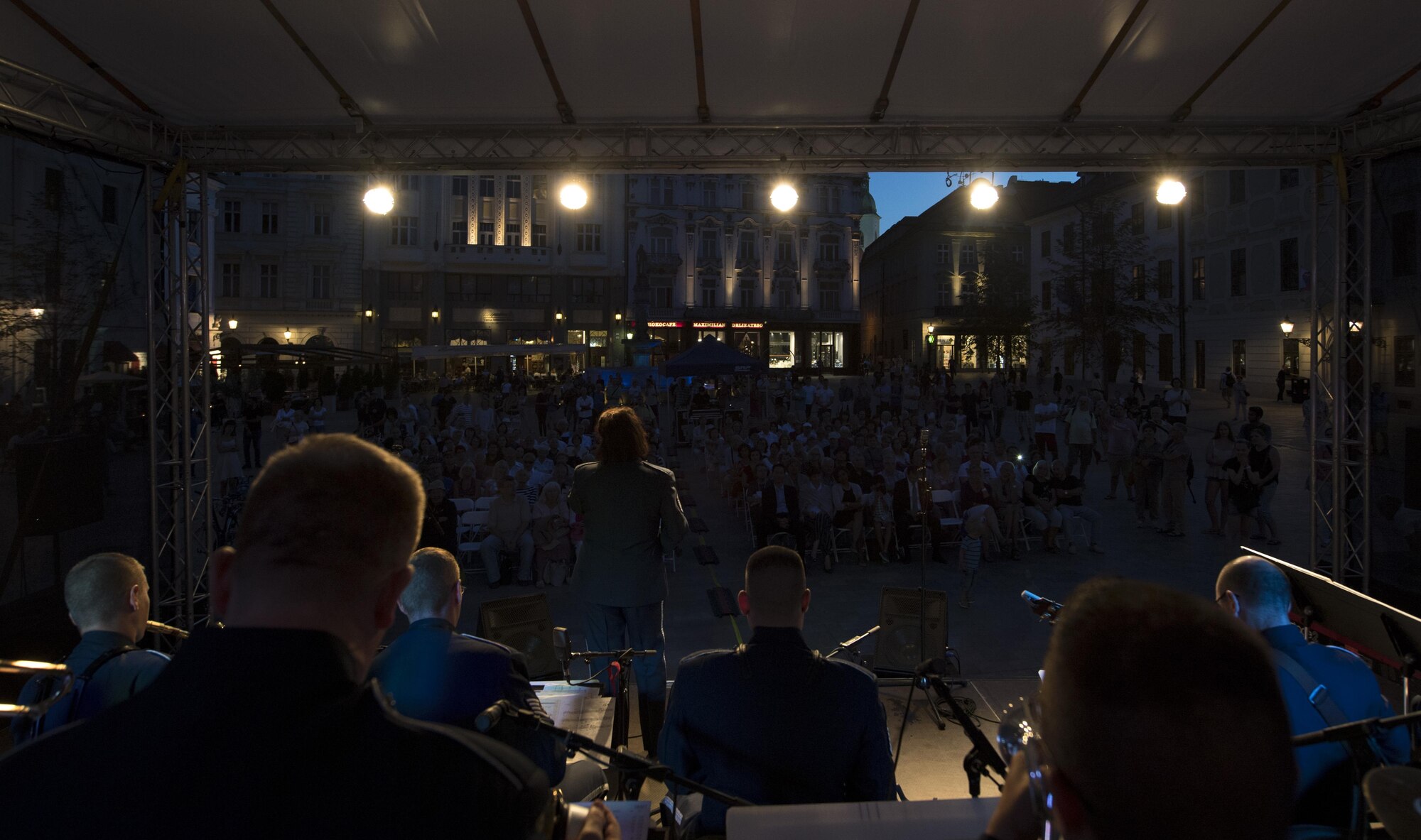 U.S. Air Force Master Sgt. Michele Harris, U.S. Air Forces in Europe vocalist, sings while other members of the band play instruments for the 73rd anniversary of the Slovak National Uprising in Bratislava, Slovakia, Aug. 30, 2017. The band was invited to perform for the event held at the Museum of Slovak National Uprising, as well as in the nation’s capital, Bratislava. The USAFE Band’s performance will help preserve the mutual commitment and trust between the U.S. and Slovakia. (U.S. Air Force photo by Senior Airman Tryphena Mayhugh)