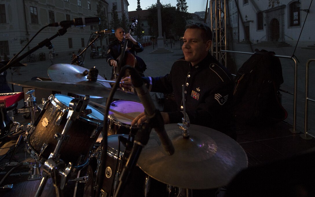 U.S. Air Force Staff Sgt. Andy Wendzikowski, U.S. Air Forces in Europe percussion, plays the drums for the 73rd anniversary of the Slovak National Uprising in Bratislava, Slovakia, Aug. 30, 2017. The USAFE band, known as the Ambassadors, was invited to perform for the celebration. Participating in events with NATO allies improves interoperability and strengthens long standing relationships. (U.S. Air Force photo by Senior Airman Tryphena Mayhugh)