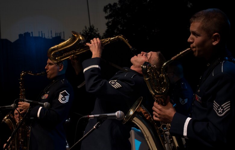 U.S. Air Force Staff Sgt. Brian Connolly, U.S. Air Forces in Europe jazz band saxophone (middle), plays the saxophone during the band’s performance for the 73rd anniversary of the Slovak National Uprising in in Banská Bystrica, Slovakia, Aug. 29, 2017. The band, called the Ambassadors, will also play in the nation’s capital, Bratislava, for the celebration. The USAFE band represents unique international musical heritage, building and preserving partnerships through official multi-national military and international community outreach events. (U.S. Air Force photo by Senior Airman Tryphena Mayhugh)