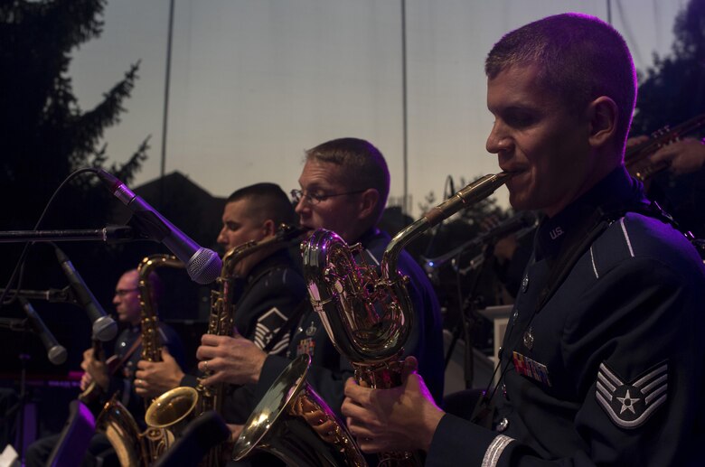 U.S. Air Force Staff Sgt. Caleb Brinkley, U.S. Air Forces in Europe jazz band saxophone, plays alongside two other saxophones while the band, called the Ambassadors, perform for the 73rd anniversary of the Slovak National Uprising in Banská Bystrica, Slovakia, Aug. 29, 2017. The USAFE Band’s performance will help preserve the mutual commitment and trust between the U.S. and Slovakia. (U.S. Air Force photo by Senior Airman Tryphena Mayhugh)